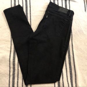 Levi’s 711 skinny black mid-rise jeans 28